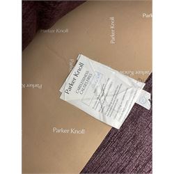 Parker Knoll - pair of large two-seat sofas upholstered in purple fabric, turned mahogany finish front feet with brass cups and castors 