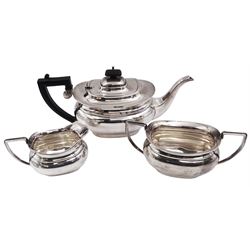 1930s three piece silver tea service, comprising teapot, milk jug and twin handled open sucrier, of oval bellied form, the teapot with Bakelite type handle and finial, hallmarked William Adams Ltd, Birmingham 1937, teapot H16cm