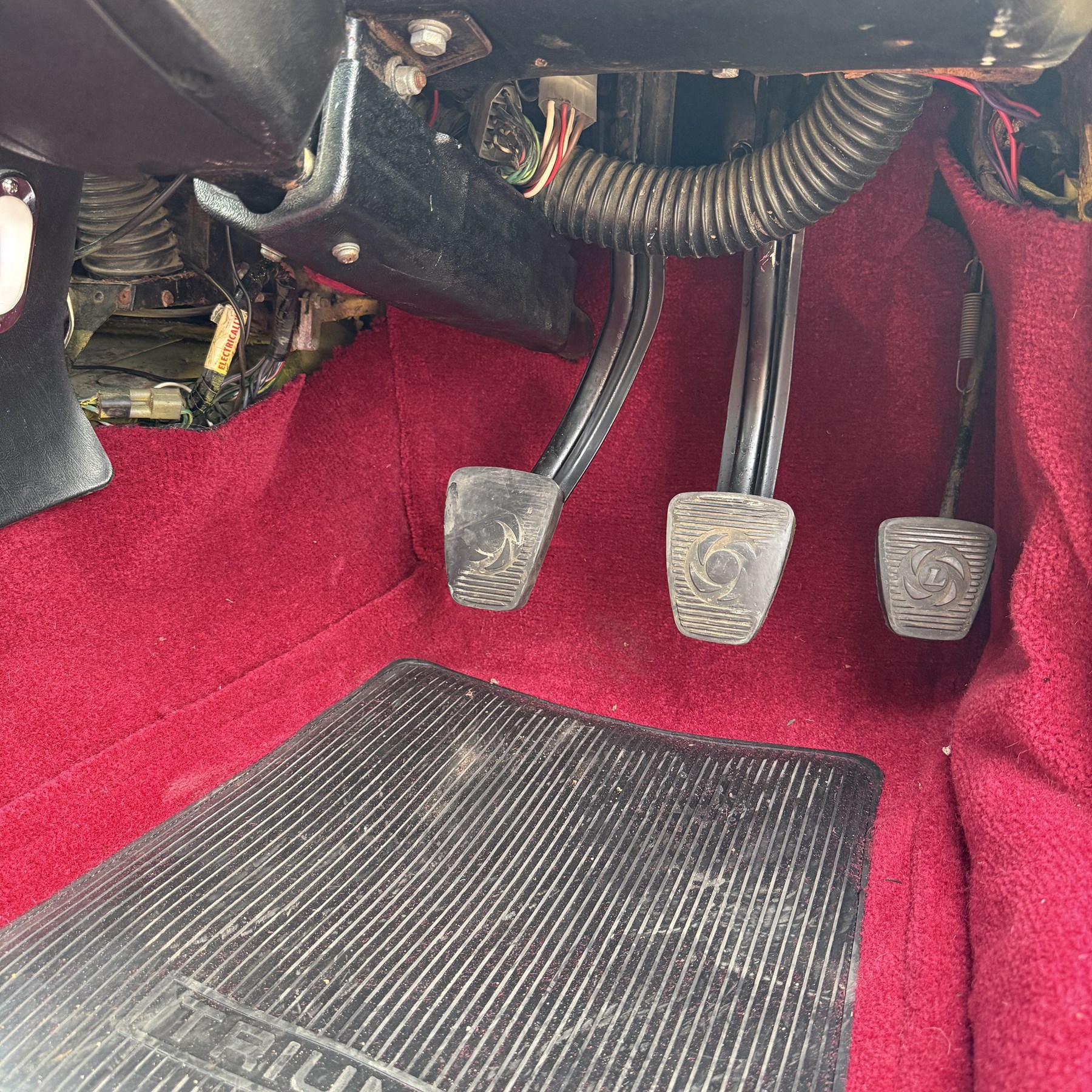 1973 Triumph Stag Mk II 3.0 V8 Manual with Overdrive

Registration: FTV 859L
Date of first registration: 8th March 1973
Recorded mileage: approximately 50,000 miles
Engine: 2,997cc petrol V8
Transmission: four-speed manual with overdrive

An attractive manual-overdrive example of Triumph’s celebrated V8 grand tourer, finished in yellow and supplied with both a removable hardtop and folding soft top.

The car has been the subject of extensive restoration and mechanical work, supported by a large history file containing invoices, notes and photographs documenting the work undertaken. The accompanying records indicate that the engine was rebuilt at approximately 36,000 miles, including re-boring of the block, checking and machining of the top faces, and steam cleaning following machining.

Further work and replacement parts are understood to include an upgraded radiator, electric cooling fan, Stag Webber header tank kit, complete set of cooling hoses and clips, fuel pump and filters, alternator, distributor cap, HT leads, spark plugs, front brake calipers and hoses, rear brake cylinders, tyres, front lights and LED bulbs. Various seals, interior trim items and seat components have also reportedly been renewed.

The car is believed to have been dry-stored from 1994 until 2017, with a substantial programme of recommissioning and improvement subsequently undertaken between 2017 and 2023. The history file also includes earlier MOT certificates dating from 1988 to 1994.

Offered with its V5C, hardtop, soft top, extensive restoration and maintenance history, photographic record and a quantity of useful spare parts, including a new dashboard veneer set.