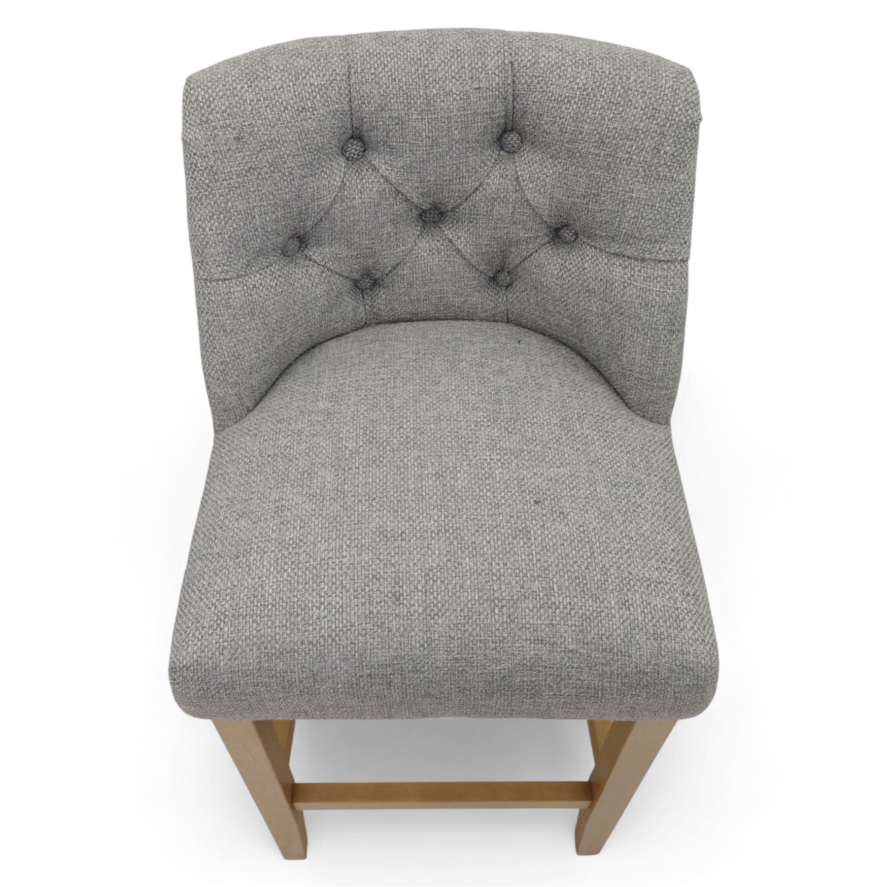 Contemporary set of three upholstered bar stools, each with button-tufted grey fabric backrest and seat, raised on light oak finish square legs united by stretchers