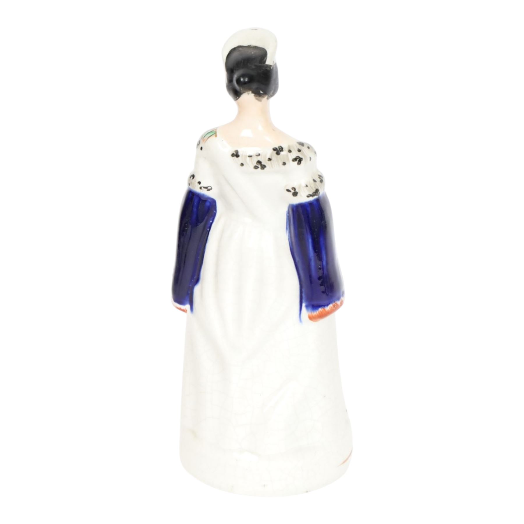 Group of 19th century Staffordshire figures, comprising pair depicting Queen Victorian and Prince Albert, she stood crowned, wearing short cloak, her hand clasped in front of her waist, he wearing cloak and military jacket, tallest example H28cm, figure group depicting The Prince and Princess Alexandra of Denmark, later Princess of Wales, he wearing green jacket and holding top hat in his left hand, she wearing bodice and full length skirt and carrying hat over he right arm, H24.5cm, and figure group depicting Empress Eugenie and Napoleon III, he in uniform, his left hand upon a plinth, she seated in chair, H23.5cm