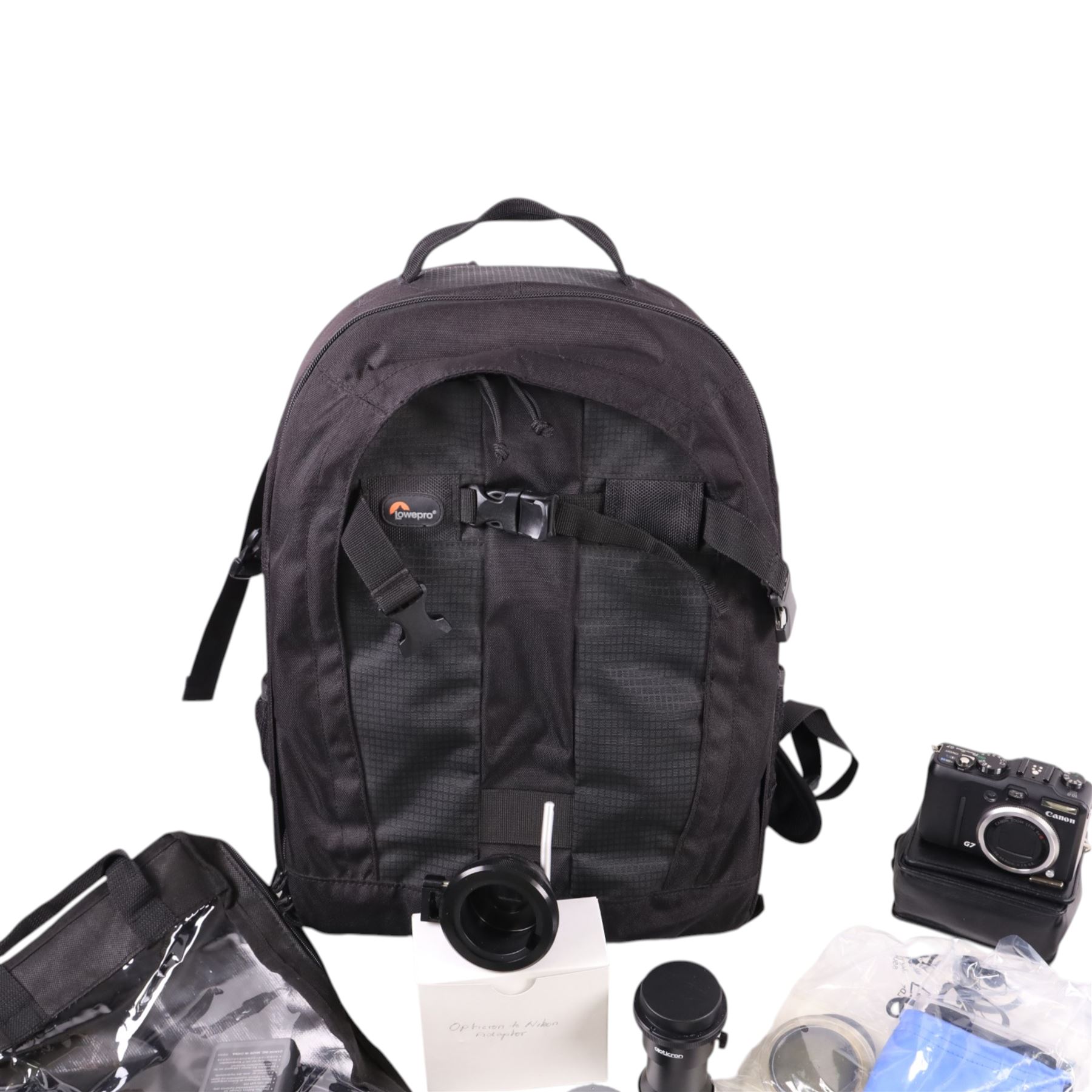 Canon G7 Powershot camera, Samsung Digimax i5 camera and a collection of camera equipment, including Lowepro bag, filters, etc