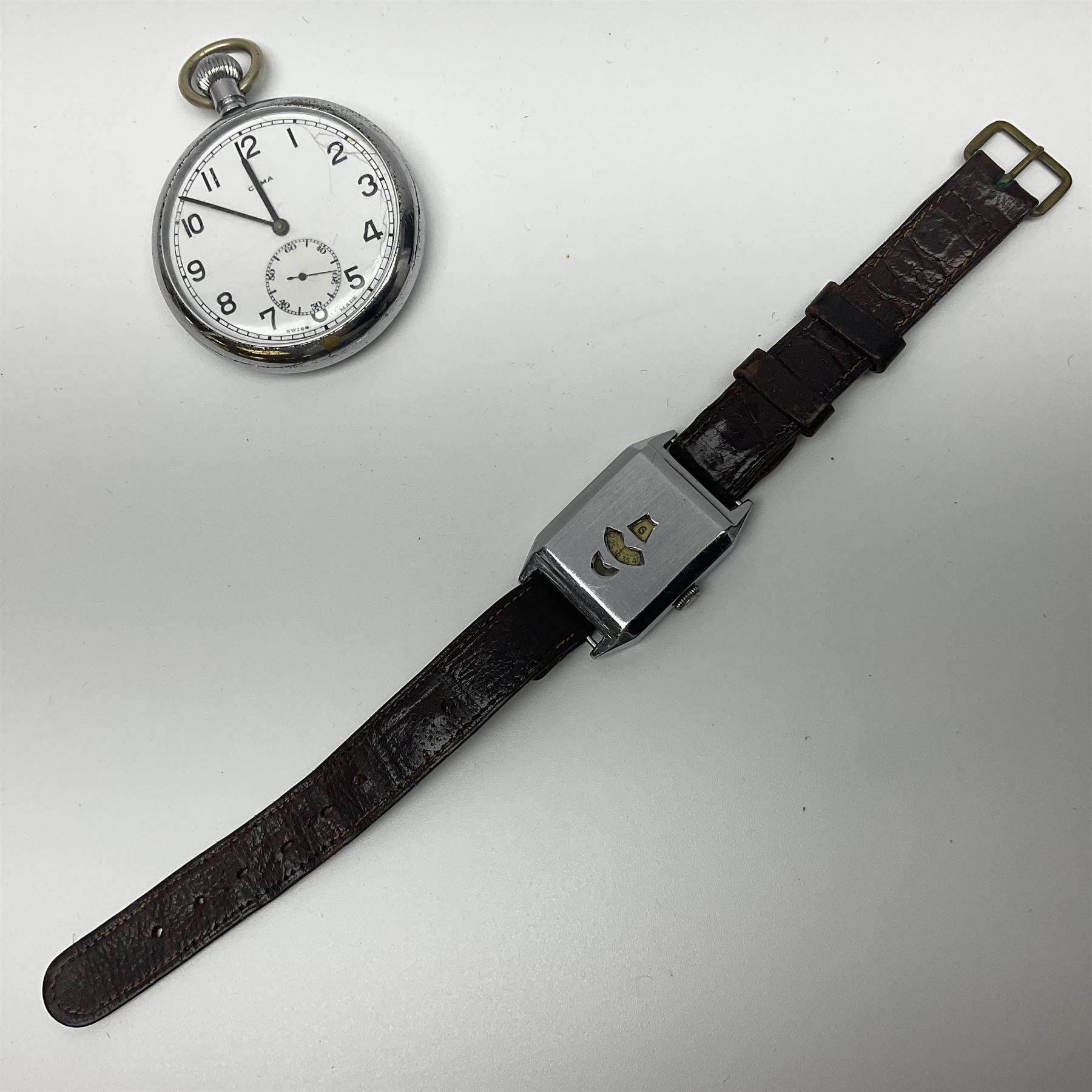 Cyma military issue pocket watch, back case No. 6E/50 A9259 and a Art Deco manual wind jump hour wristwatch