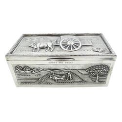 20th century unmarked Indian silver cigarette box, of rectangular form the hinged cover and sides embossed with panels depicting rural scenes, opening to reveal a softwood lined interior, H7.5cm L18cm D9cm 