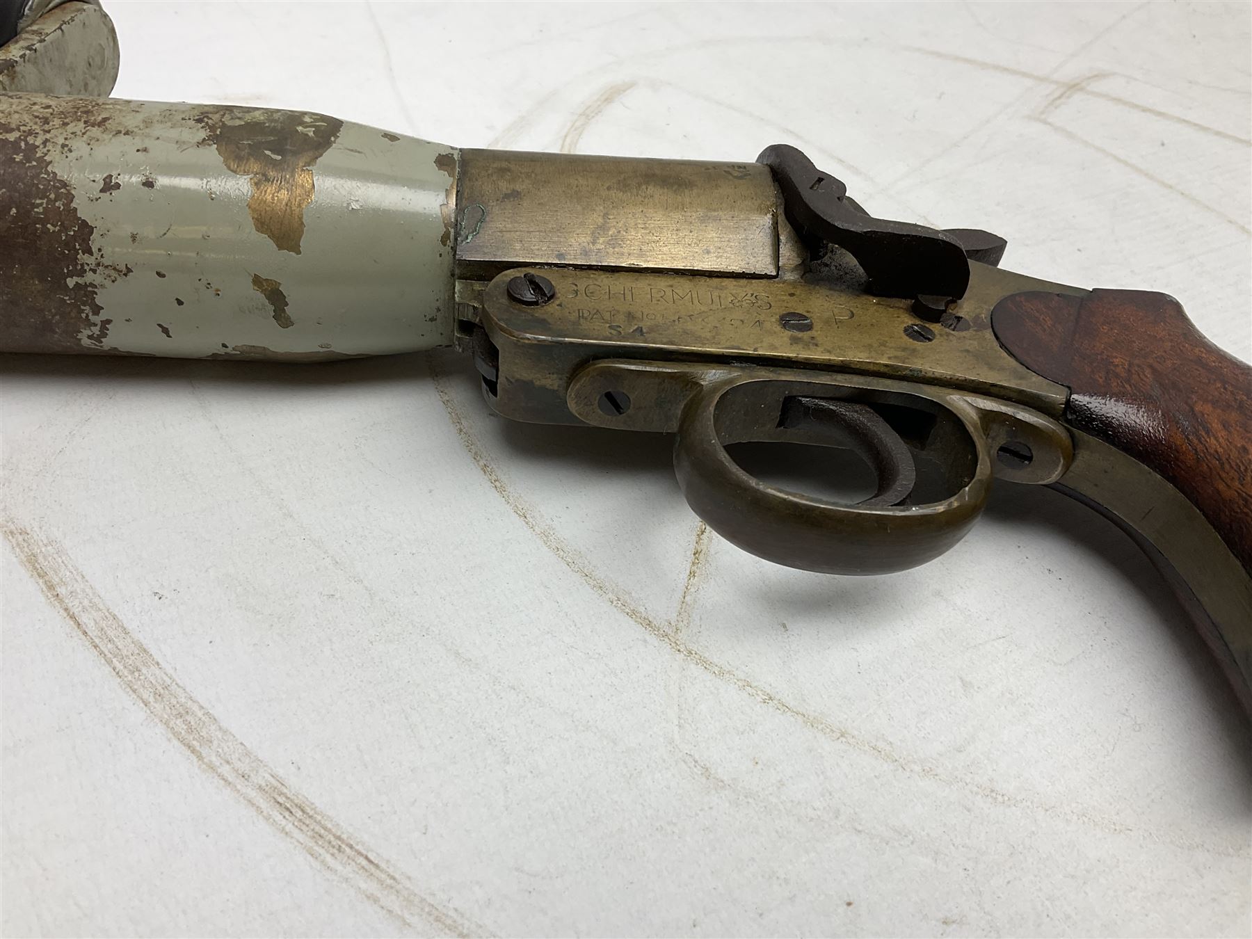 Schermulys Patent No.503324 nitro proof line throwing pistol No.15003; brass body with proof marks; the 32cm steel barrel with secondary handle over and original transfer 'The Schermuly Pistol Rocket Apparatus Ltd. London' L51cm overall