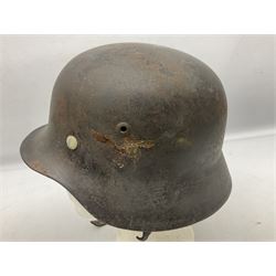 WW2 German Luftwaffe M40 double decal steel helmet with liner and chin strap; impressed NS62 to side skirt and D236 to back skirt