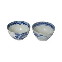 Two 19th century Chinese blue and white tea bowls, each decorated with traditional landscapes, together with two similar saucers, tea bowl H5cm, D9cm  