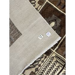 Mid-20th century Persian Bakhtiari rug, ivory ground with alternating dark brown and ivory panels featuring geometric and floral designs, bordered by a plain ivory band