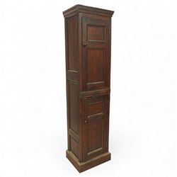 Early 20th century tall pine cupboard, rectangular moulded cornice above two panelled door...