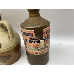 Large stoneware two tone flagon with black lettering Folkard Chemist Pavement York, together with two stoneware jugs, Bronte Yorkshire Liqueur and Creedy Vintage Cider, and salt glaze example, together with four vintage glass bottles, tallest H33cm