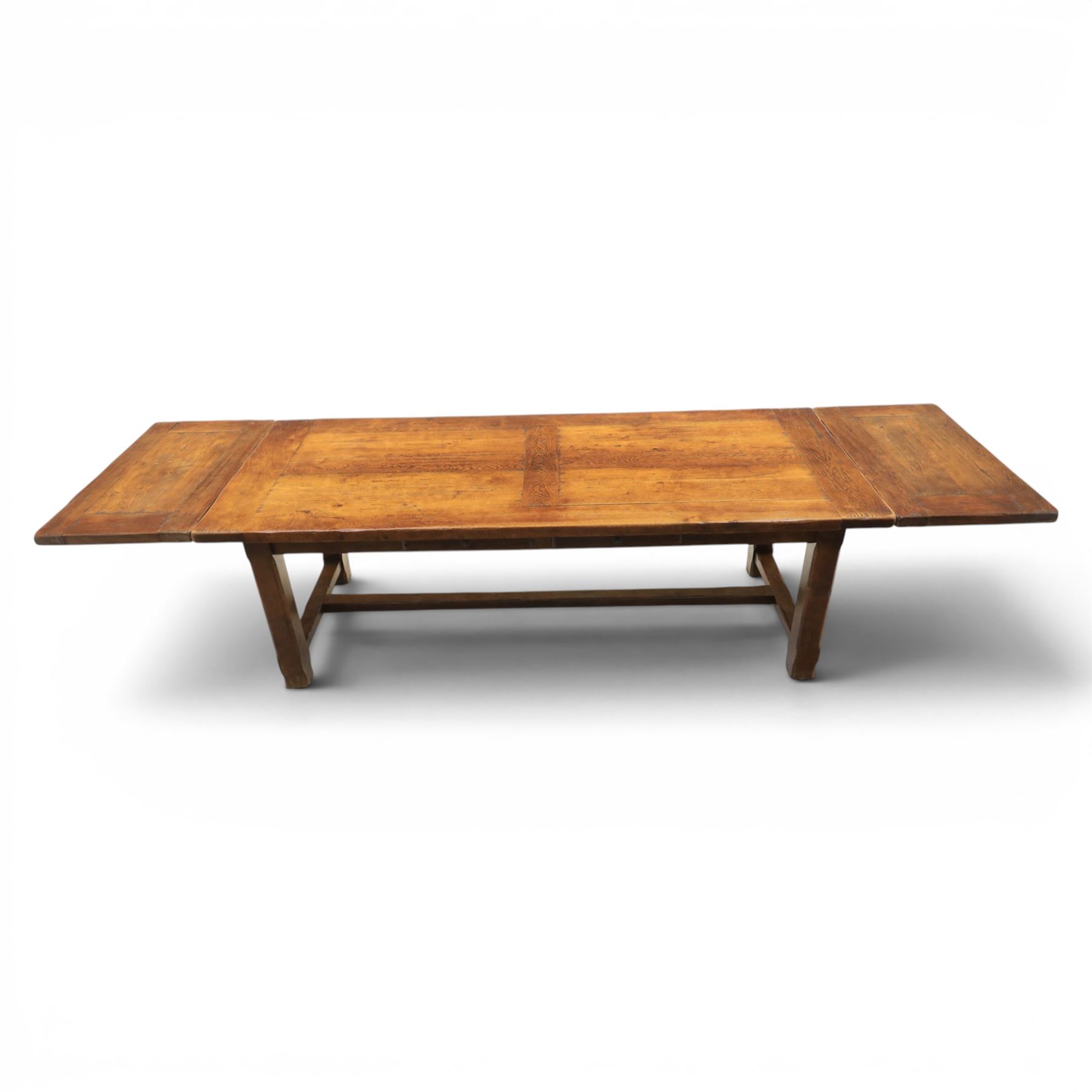 Country pine draw leaf table, bench seat and six chapel chairs, the top of plank construction, with two frieze drawers, additional leaves extending to 320cm, with bench seat and six elm chapel seats