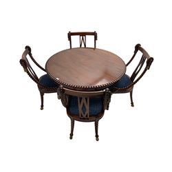Regency style dining set - the table with circular tilt-top on turned and carved column, concaved triangular platform with three scroll carved feet, together with set four rope twist dining chairs with upholstered drop in seats