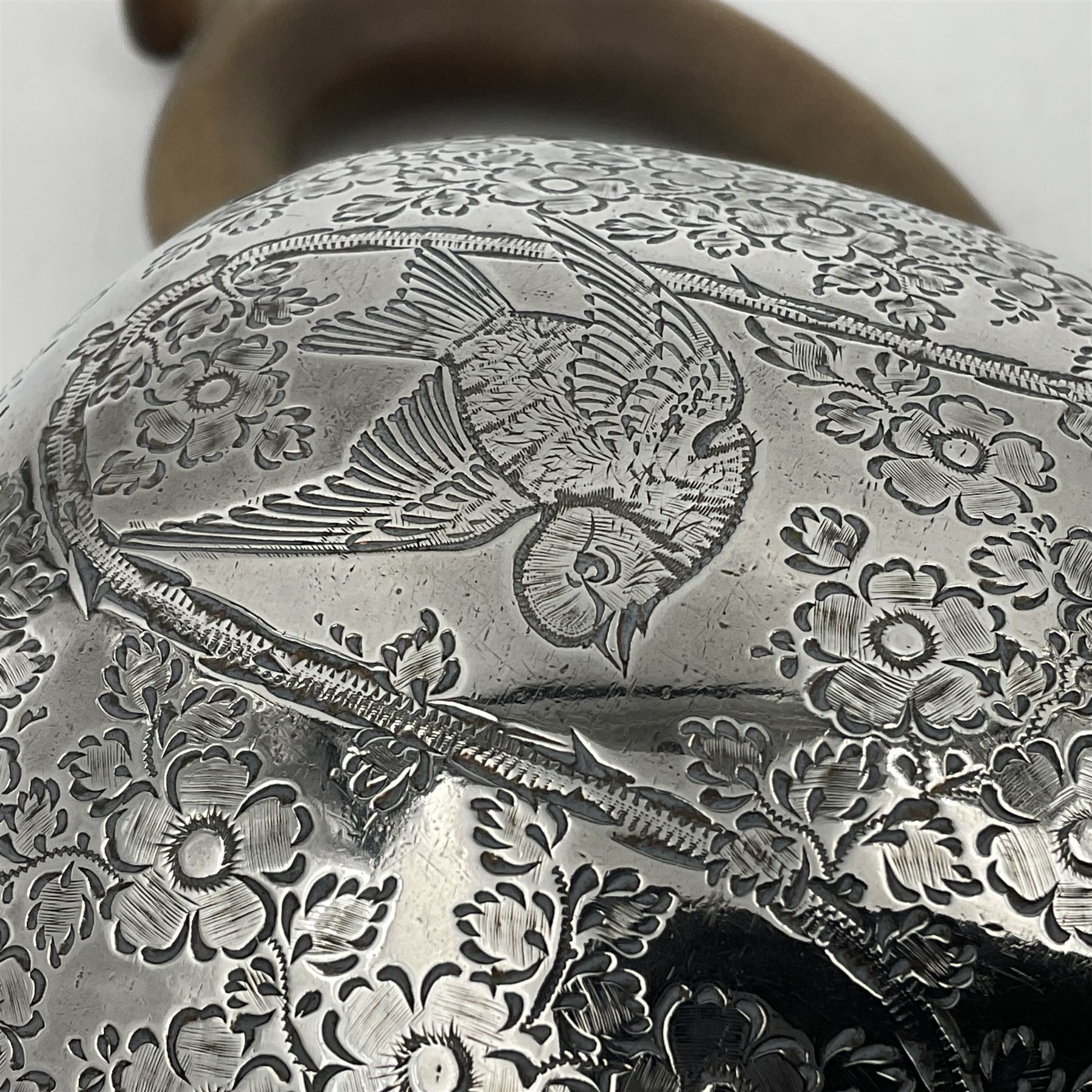 Late Victorian silver bachelors three piece tea service, comprising bullet shaped teapot, open sucrier and milk jug, each engraved with monogram surrounded by birds upon and amidst a blossoming vine, the teapot with scroll capped curved wooden handle and wooden finial to cover, hallmarked Wakely & Wheeler, London 1890, teapot including handle H12cm, sucrier H5.5cm 