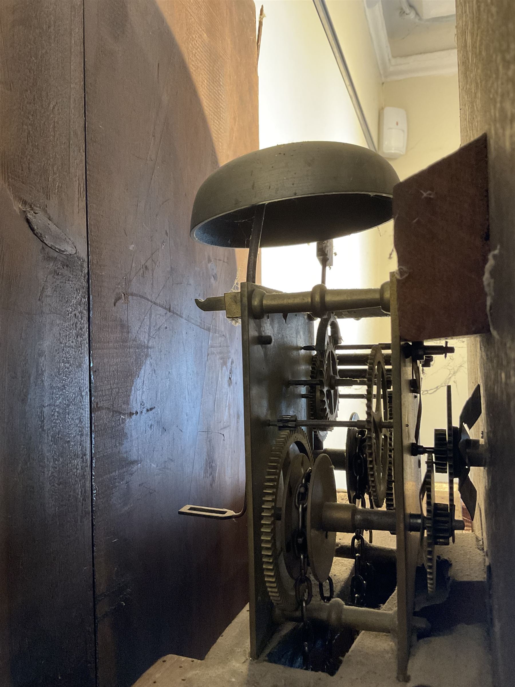 Late 19th century 30 hour Yorkshire mahogany longcase clock, with a swans necked pediment and break arch hood door flanked by two ring turned pilasters, trunk with a short door with a bone escutcheon on a wide plinth with a recessed panel, painted dial with a depiction of a sportsman to the arch and game birds to the spandrels, Roman numerals, minute markers and brass hands, chain driven countwheel striking movement. With weight and pendulum.