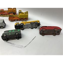 Dinky - thirteen unboxed and playworn die-cast commercial vehicles including two Supertoys 20-Ton Lorry-Mounted Cranes; Leyland Octopus Tanker; Fire Engine No.955; Extending Mast Vehicle No.969; two TV Roving Eye Vans No.968; three Ford Transit Vans; Brinks Armoured Car No.275; etc