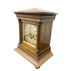 German  - H.A.C. mahogany cased 14-day striking mantle clock, in an architectural case with a gable pediment, square brass dial and silvered chapter ring flanked by two turned pillars with capitals, wide stepped plinth raised on bun feet. With pendulum and key.
.