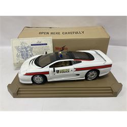 Two Maisto 1:12 scale Jaguar XJ220 scale cars comprising 1992 ‘Concept Car’ West Midlands Police car and 1994 ‘Jag 999’ Thames Valley Police Traffic Car, both on plinths with original boxes and certificates of authenticity 