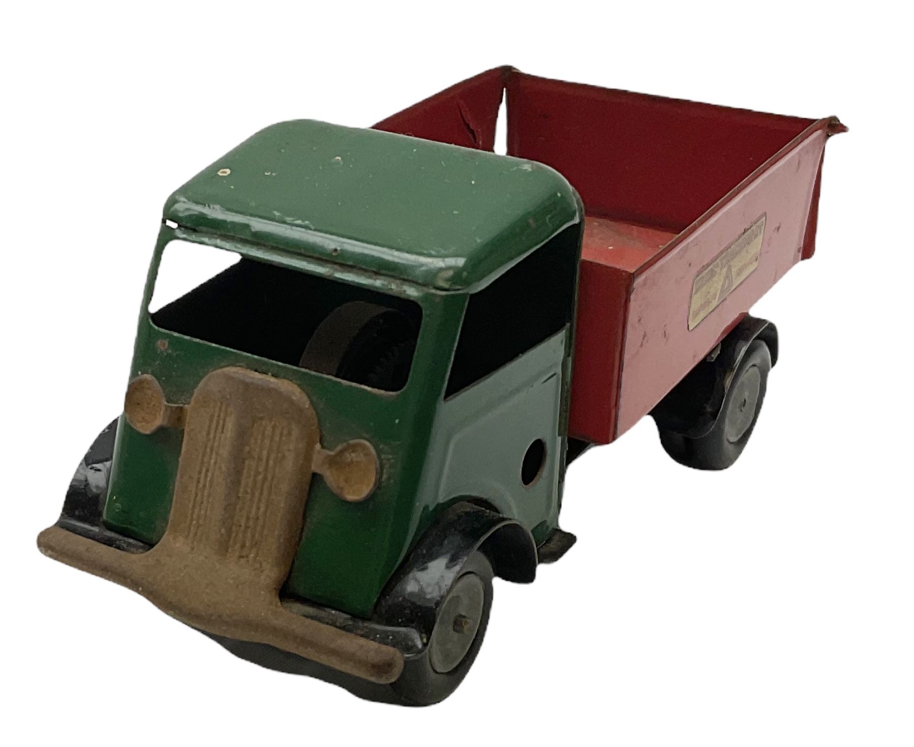 Eight Tri-ang Minic tin-plate/plastic clockwork vehicles comprising Tipper Lorry, Post Office Telephones Van, Caterpillar Tractor, Evening News Van, two Royal Mail Vans, American jeep and saloon car; all unboxed (8)