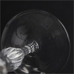 Set of six Murano clear glass wine glasses, each with part moulded fluted flared bowl, upon a knopped and fluted baluster stem and spreading circular foot, with etched marks beneath, H19.5cm