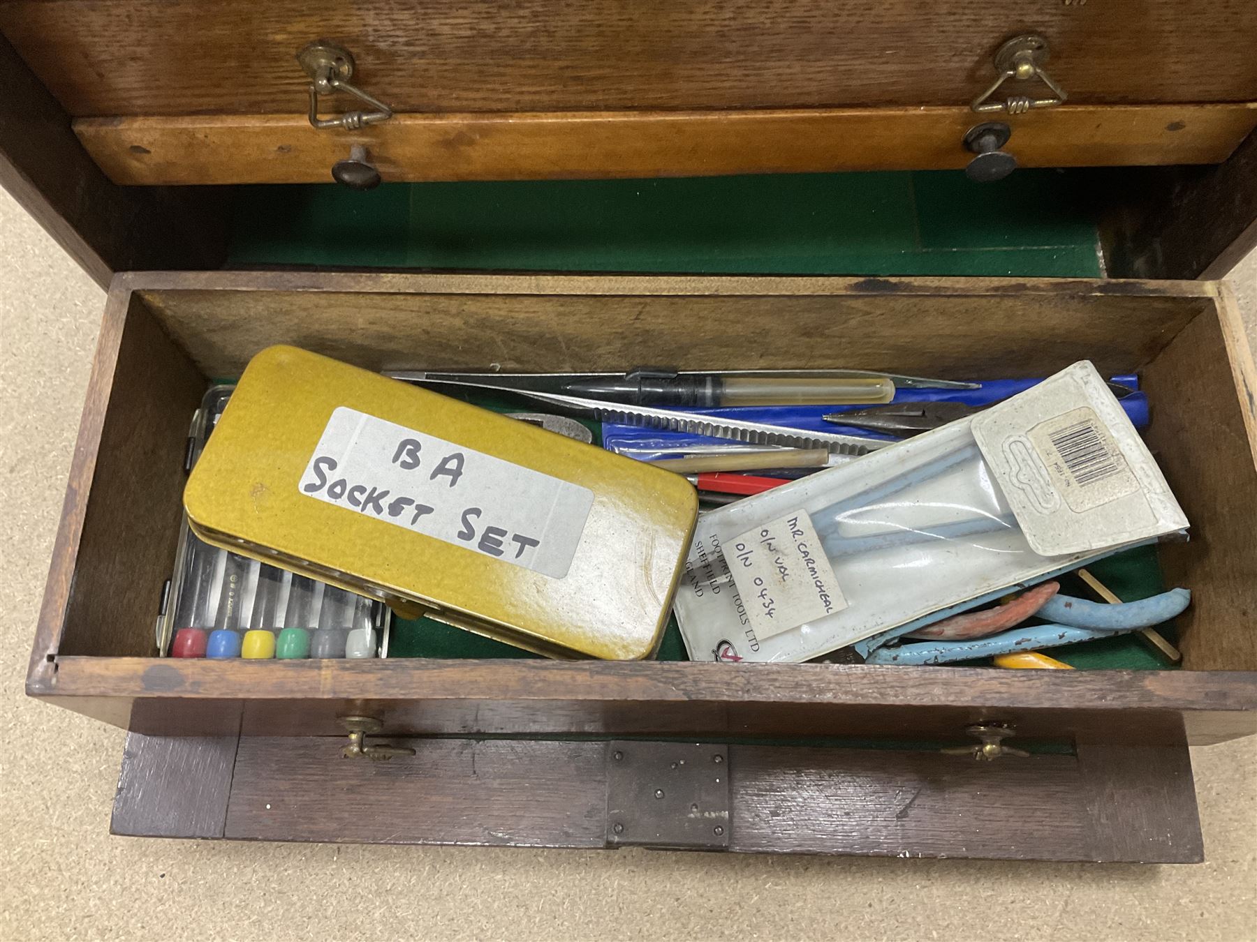 Six shelved cabinets for displaying ‘00’ gauge locomotives comprising plain plywood and white painted examples with track applied to various shelves, largest H63cm, W107cm, D27cm; Collection of tools for building model locomotives to include Weller PU-2D Soldering Pencil and Standard Tip Soldering Iron 20W/230V, Humbrol Modellers Airbrush, Power Supply Units and two wooden chests one of which housing a collection of tools including tweezers, scalping tools, wrenches etc 