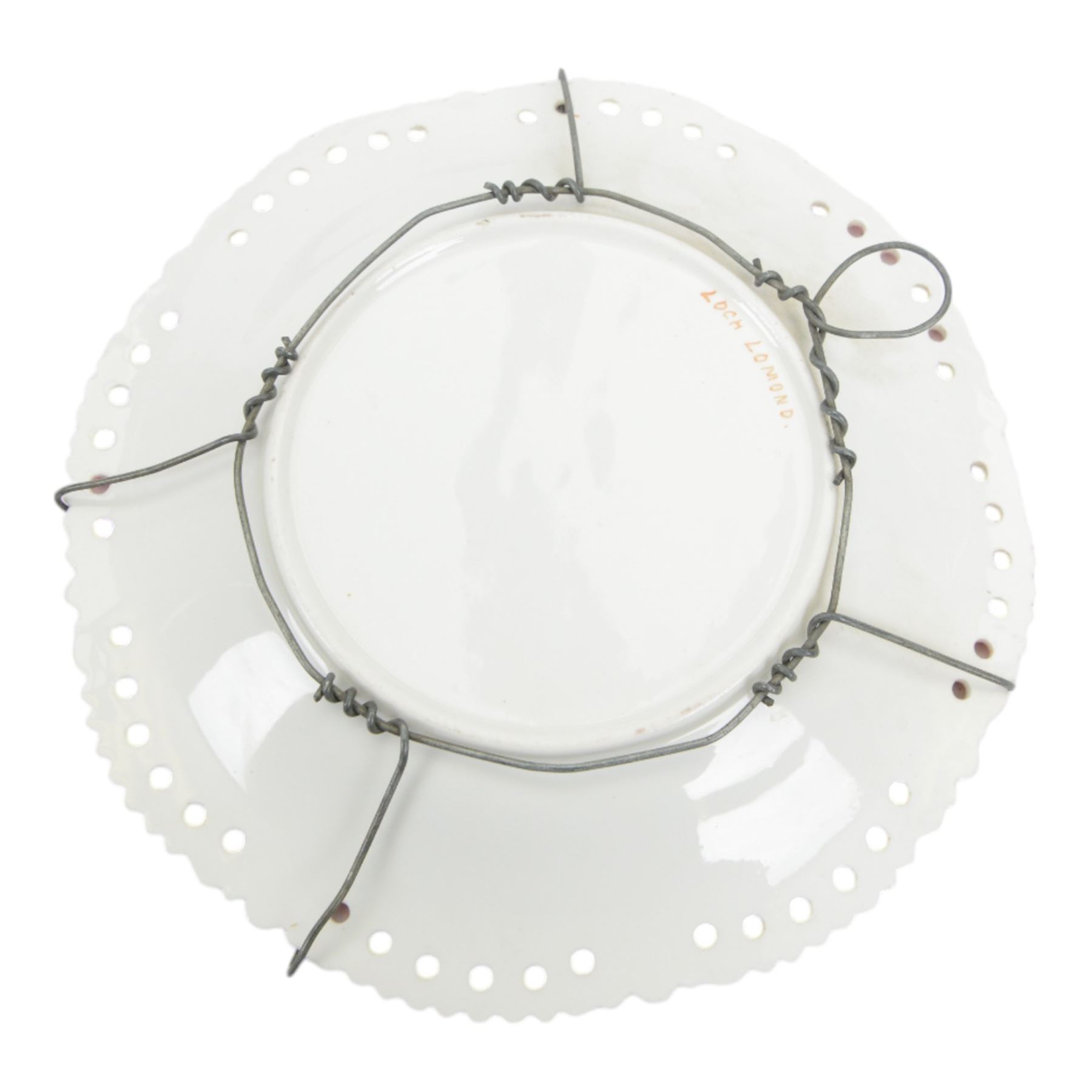 Two 19th century Samson porcelain plates, decorated in the Chelsea style with exotic birds, flowers and insects, each with spurious gold anchor mark verso, largest example D24cm, together with a 19th century dessert plate, possibly Worcester, hand painted with a hummingbird, within a gilt band and pink border, D22.5cm, and a further 19th century dessert plate with shaped and pierced rim, hand painted with a view of Loch Lomond and titled verso, D22cm, (4)