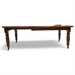 Late Victorian mahogany extending dining table with two leaves, moulded chamfered edge above, turned and reeded legs and ceramic castors, winding handle included, 205cm extended, 132cm closed, 102cm wide, 73cm high