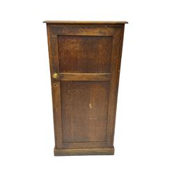 Early 20th century oak cupboard, fitted with two shelves, on plinth base