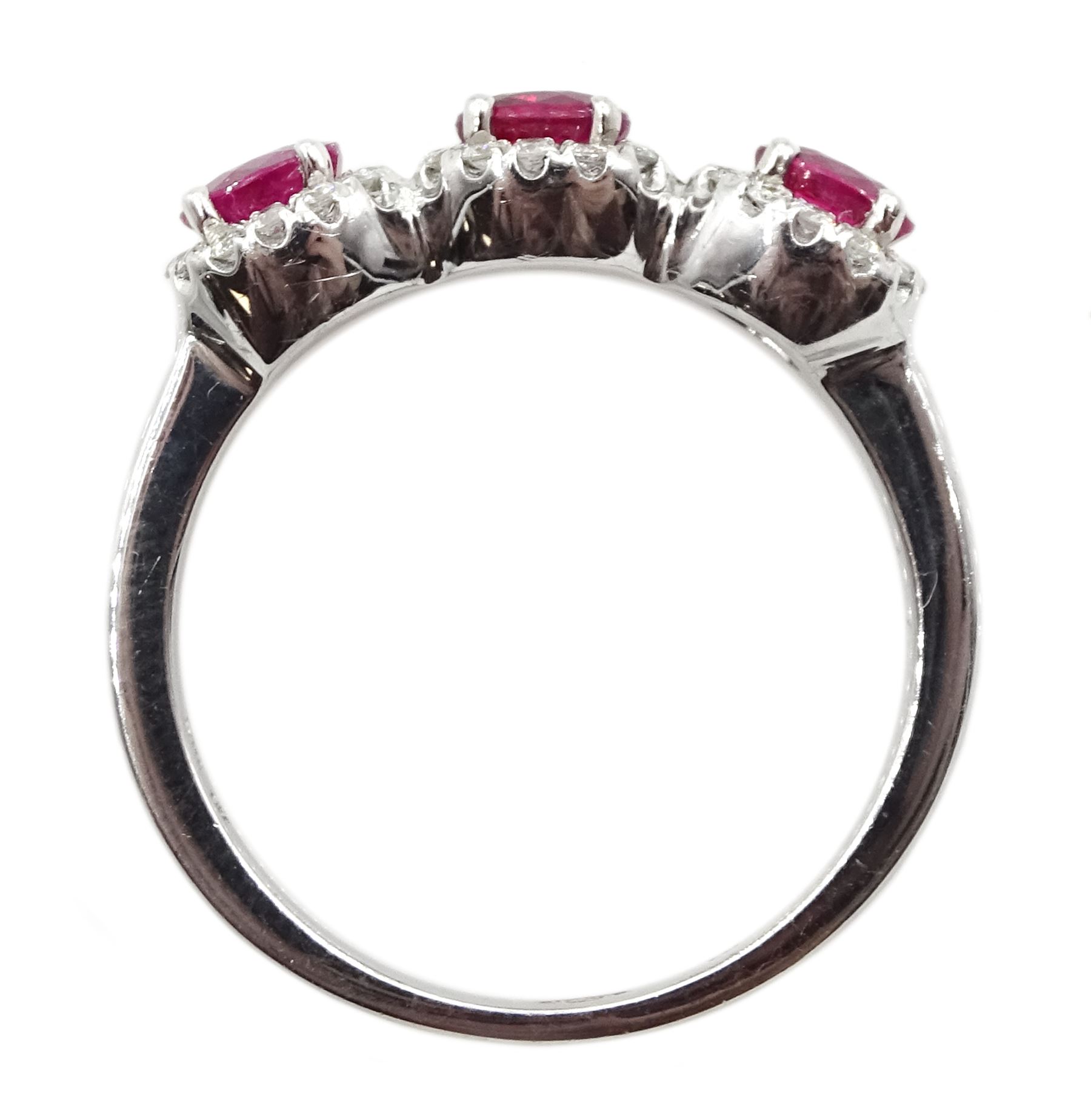 White gold three stone oval ruby and round brilliant cut diamond cluster ring, hallmarked
