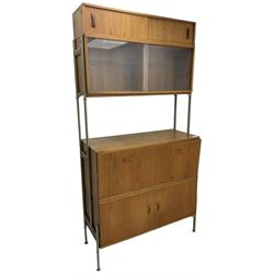 Remploy - mid-20th century teak sectional wall display unit or room divider, raised display cabinet section with sliding glass doors, central fall front section, lower double cupboard section and an additional sliding door section 