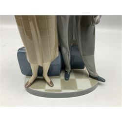 Lladro figure, Sad Parting, modelled as a man and woman with suitcases, sculpted by Francisco Catalá, with original box, no 5583, year issued 1989, year retired 1991, H33cm