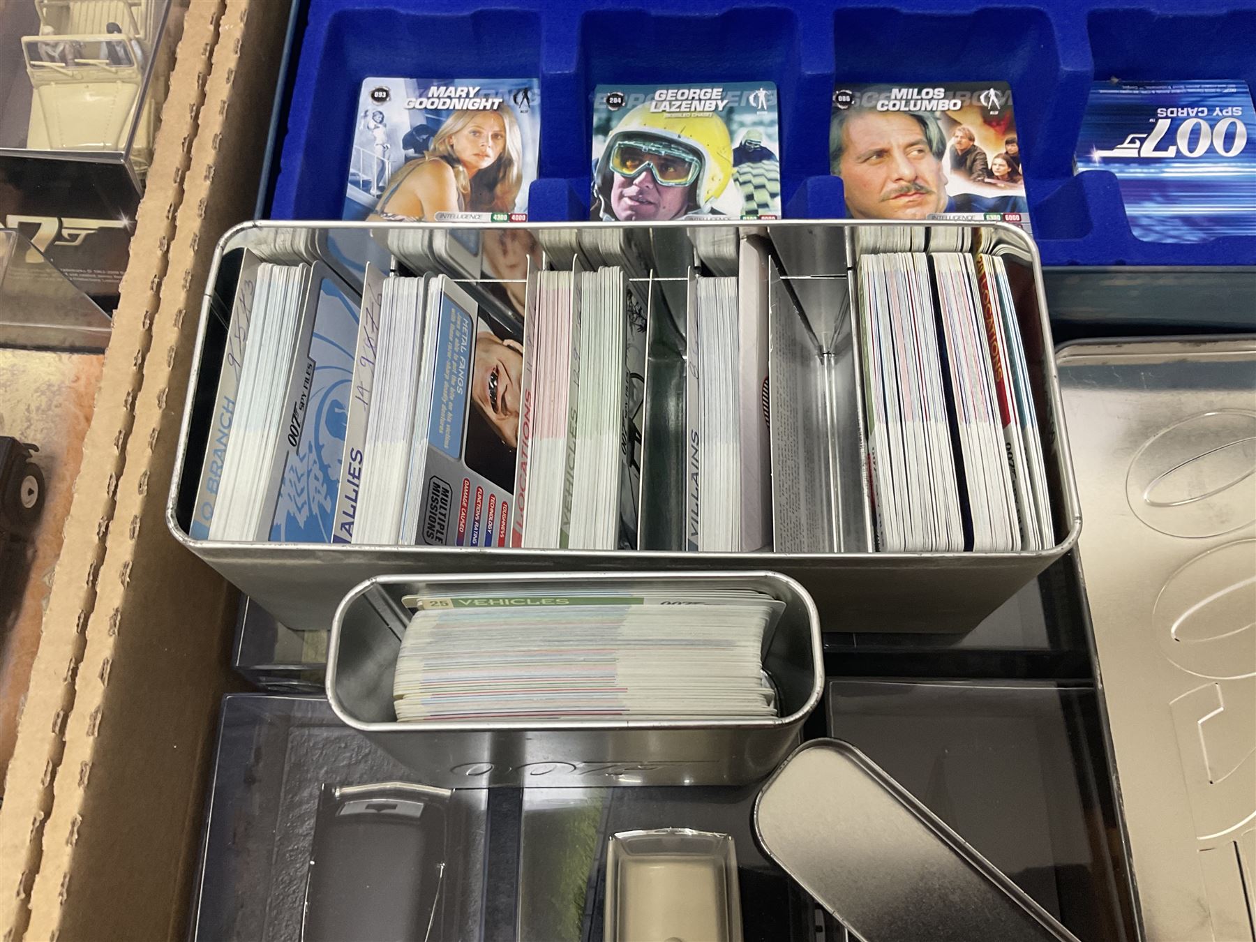 Fabbri James Bond Collection - over one hundred and ten die-cast models in perspex display cases as issued periodically; and a quantity of associated magazines and trading cards, in five boxes