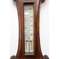  Early 20th century carved oak barometer (H75cm), and an Edwardian mahogany cased barometer   