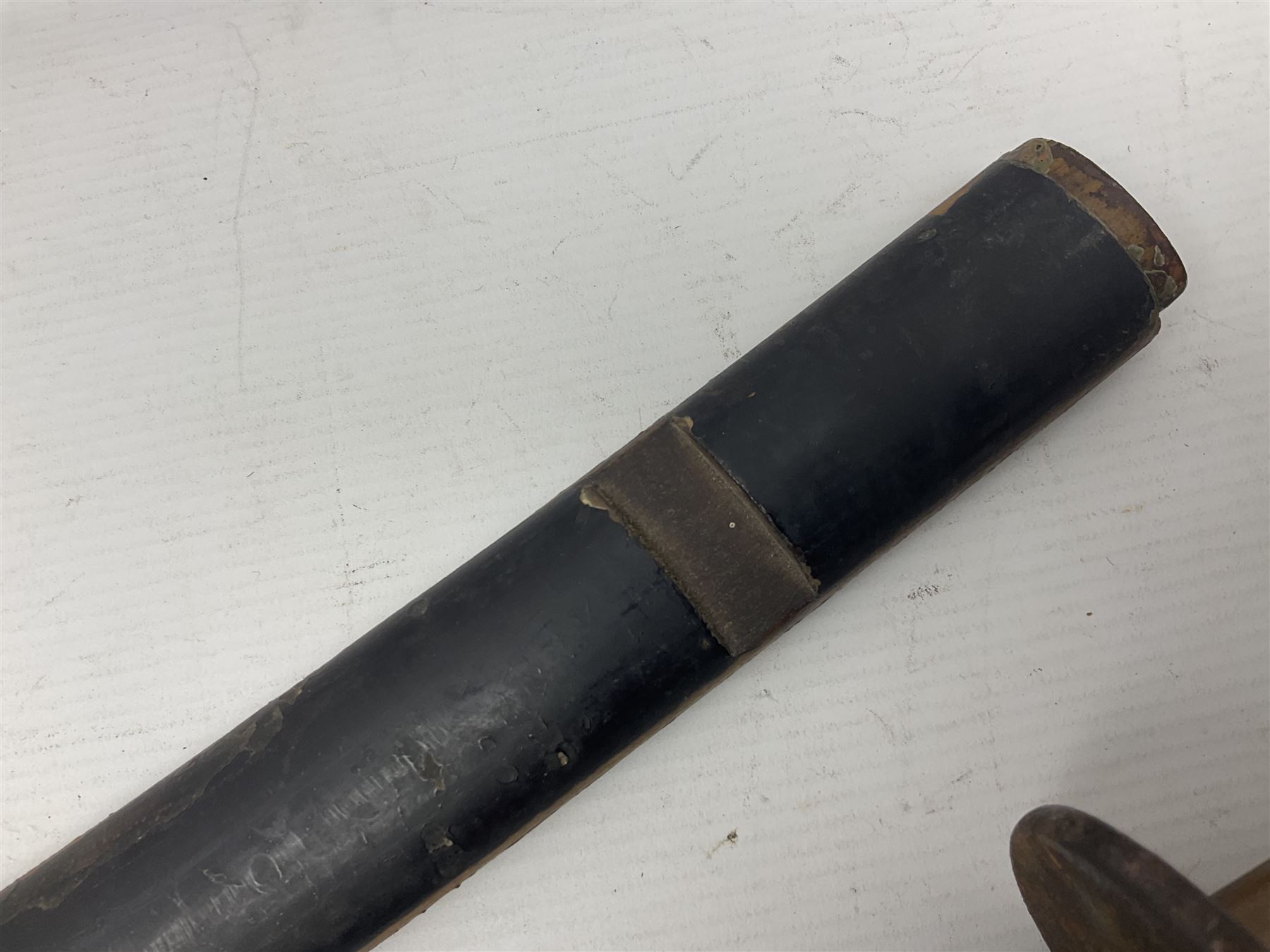 Good quality Japanese sword blade with later WWII fittings and scabbard  - 67.5cm slightly curving blade with unmarked tang, plain iron tsuba and lacquered grip with copper mounts; in lacquered wooden scabbard with tape bound tip L94cm overall