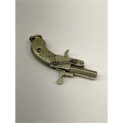 Miniature all nickel .22 pin fire single shot pistol with engraved grip and suspension ring to the butt L4.5cm