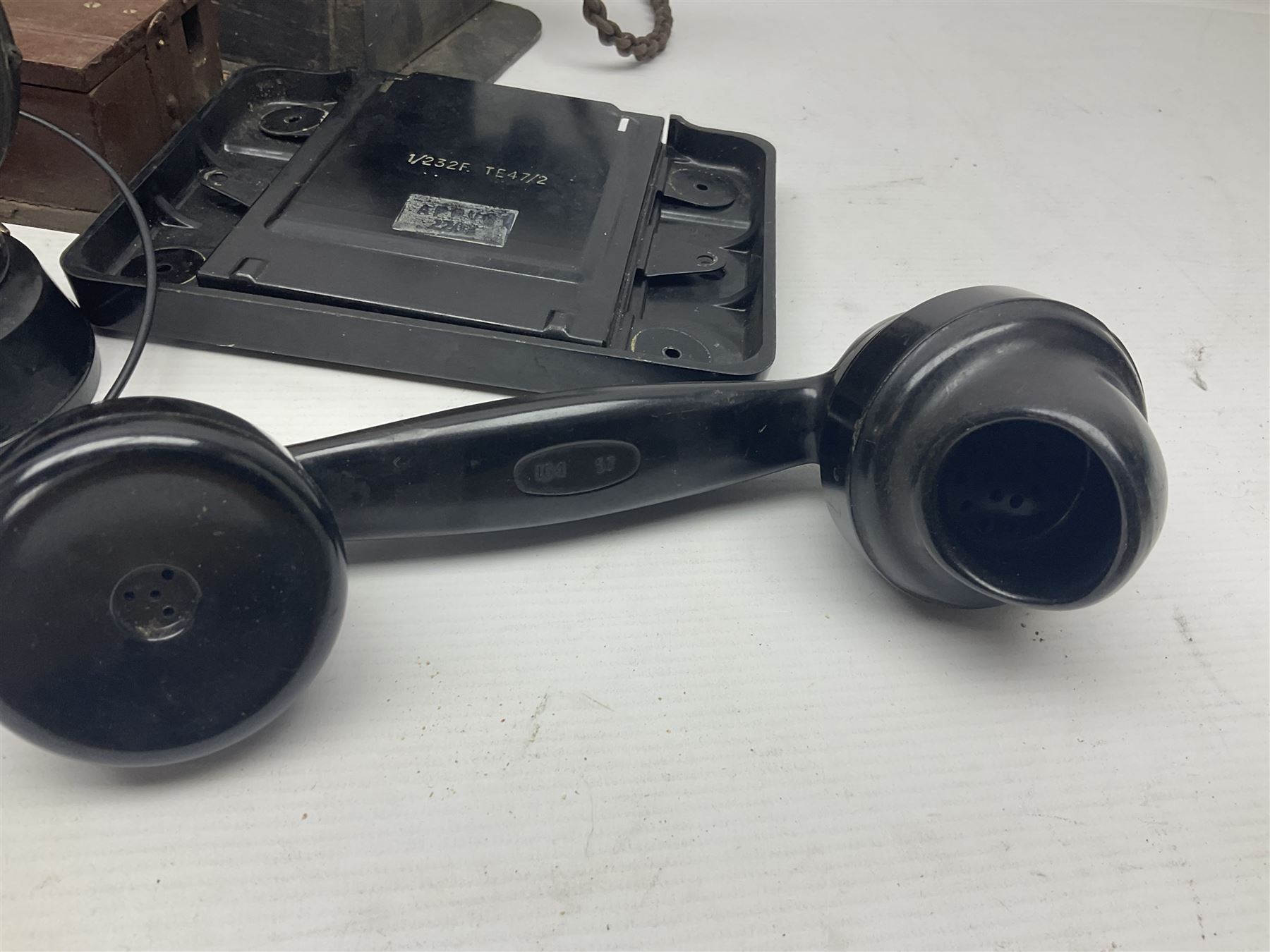 Collection of phone headsets, including GPO bakelite examples, together with other telephone parts 