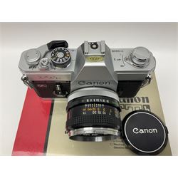 Canon FTb camera body, serial no. 715838, with 'Canon FD 50mm 1:1.8' lens, serial no. 207888, in original box, together with Canon FTb camera body, serial no. 557817, with 'Canon FD 35mm 1:3.5 S.C' lens, serial no. 126210 and Canon EX Auto camera body, serial no. 296244 with 'Canon EX 50mm 1:1.8' lens, serial no. 380869  