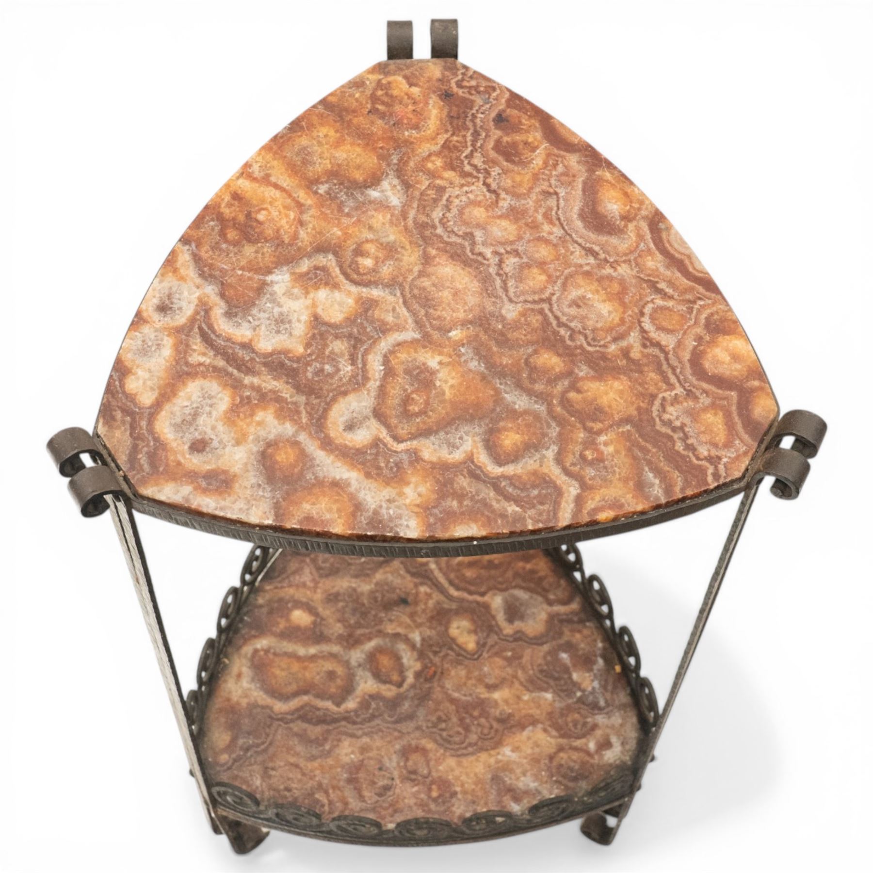 Art Nouveau wrought metal and specimen marble two-tier occasional table, the triangular marble top raised on strap metal uprights with scroll capitals, the under-tier with raised Vitruvian scroll design gallery