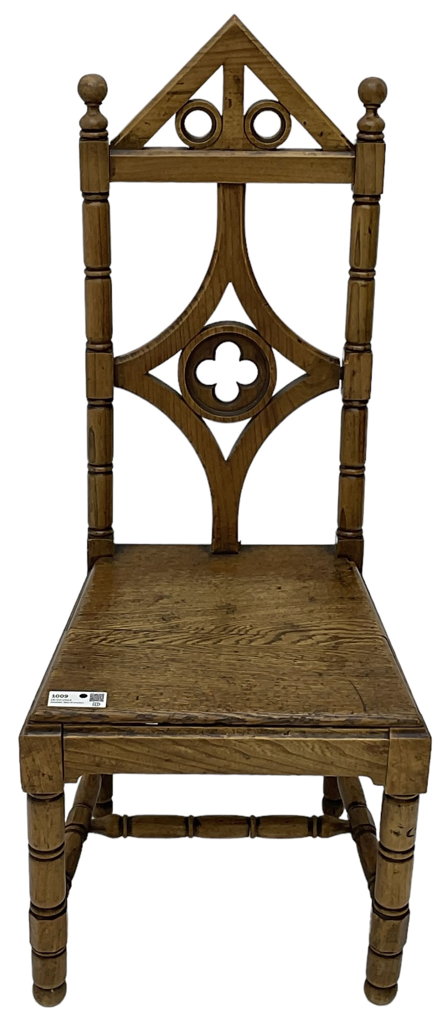 19th century Gothic elm chair, pointed cresting rail over shaped back with central quatrefoil roundel, on turned supports united by turned H-stretchers 