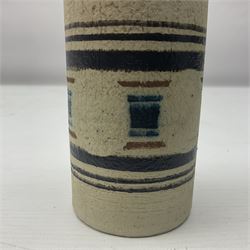 Troika cylindrical vase decorated with circles upon a striped backdrop, designed by Linda Taylor, with painted marks beneath, H14cm