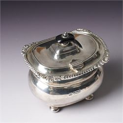 Edwardian silver tea caddy with hinged lid, ebonised lift and gadrooned edge on compressed bun feet Sheffield 1910 Maker Harrison Bros. and Howson