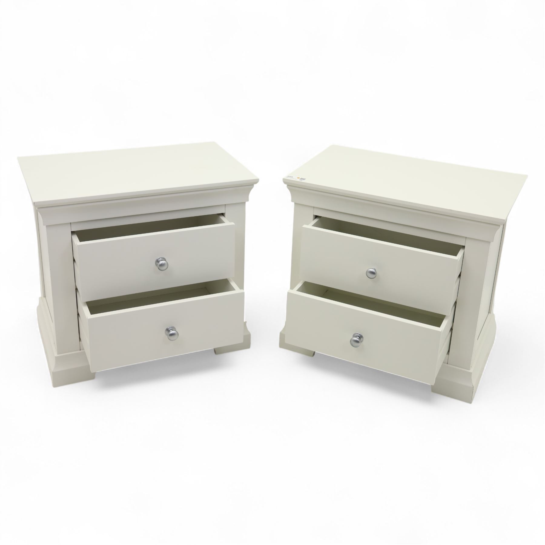 Coxwold Company - pair of white painted jumbo bedside cabinets, with two deep drawers and chrome knob handles,  shaped apron base