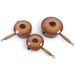 Set of three Le Creuset pans and lid