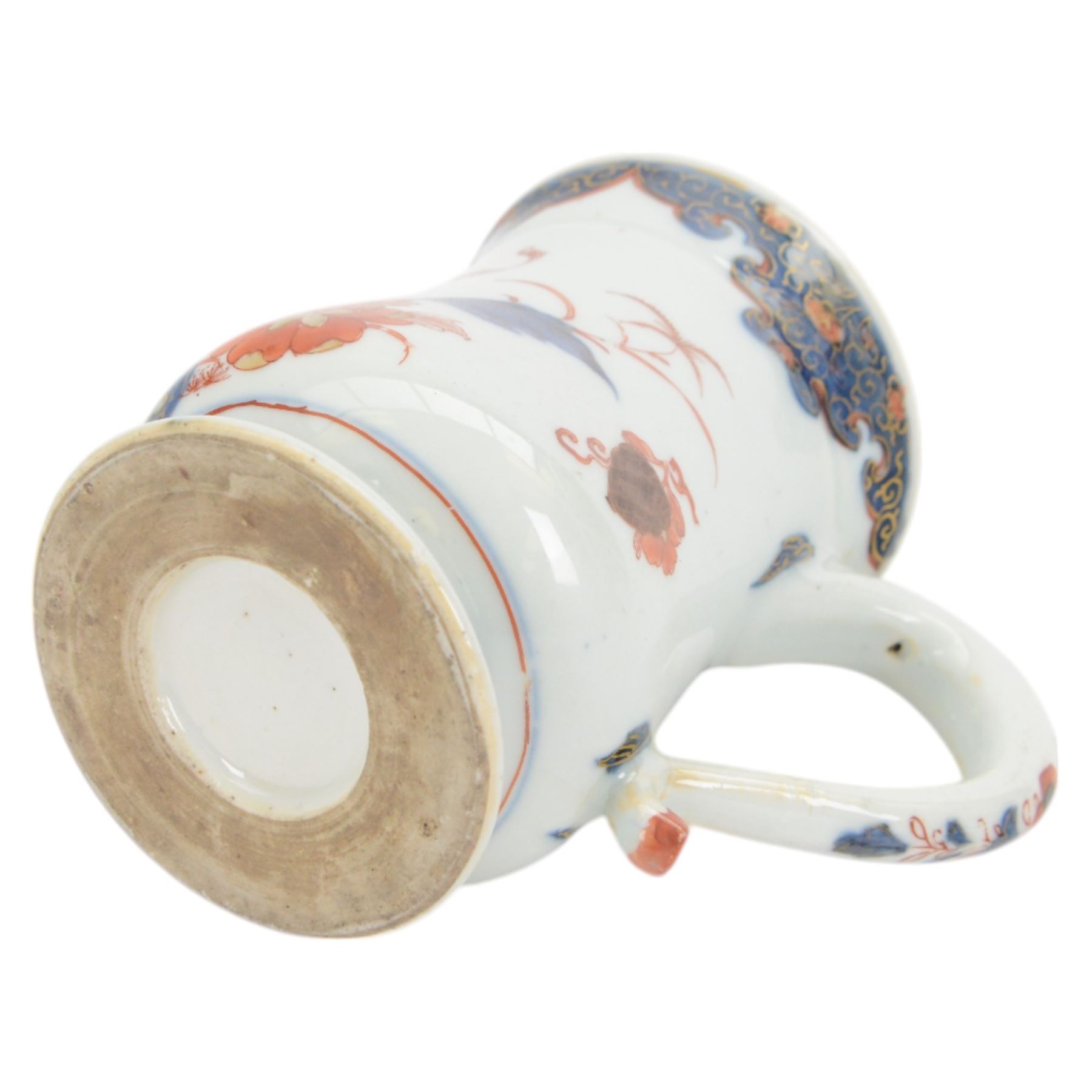 Pair of 18th century Chinese export tankards, each of bellied form with curved handle and circular foot, decorated in the Imari palette with peonies, chrysanthemums and bamboo, H12.5cm