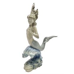 Lladro figure, Mermaid on Wave, modelled as a mermaid with one arm raised, H40cm