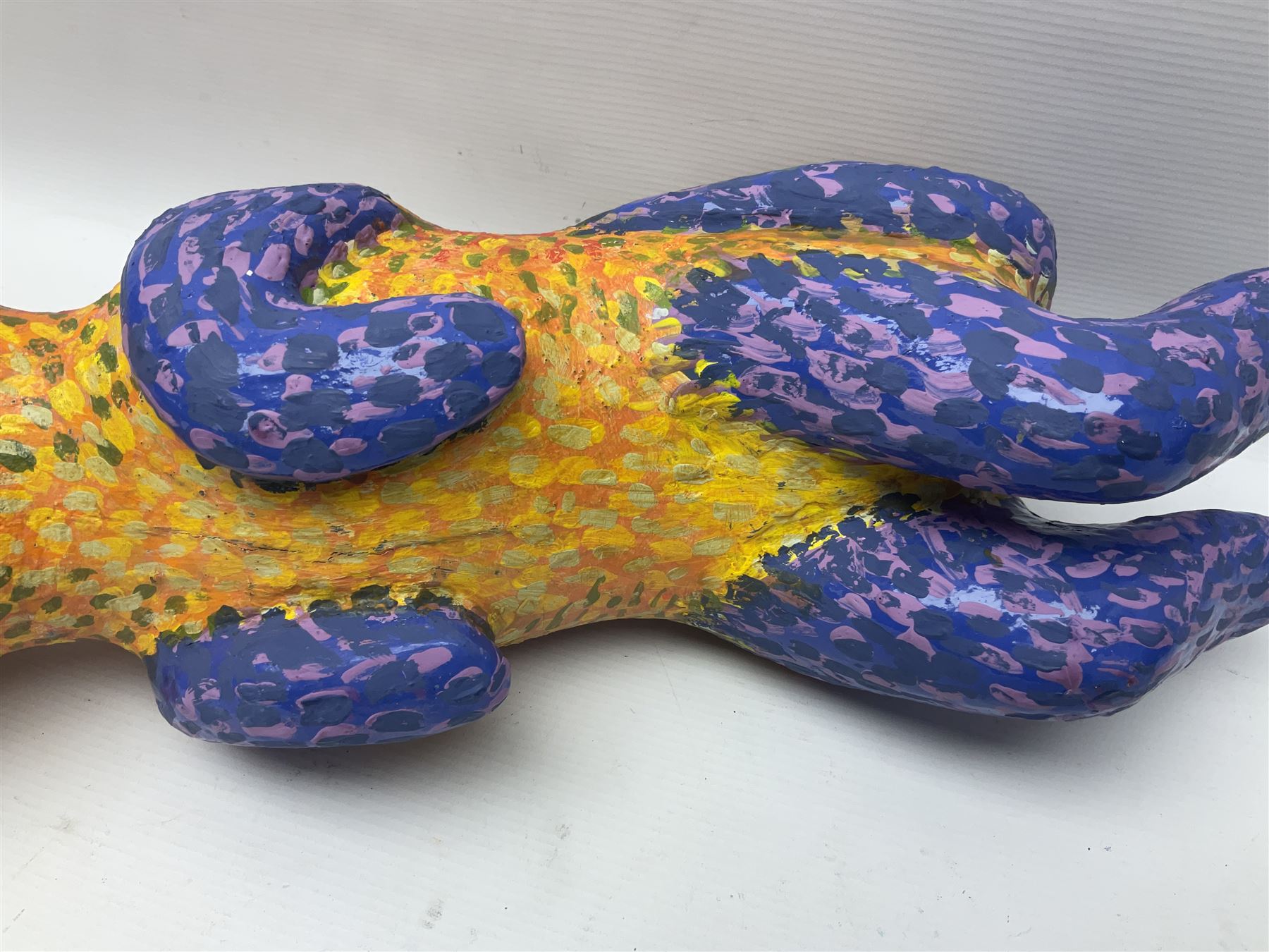 Helen Skelton (British 1933 – 2023): Two carved wooden abstract sculptures, one modelled as a dog, the other modelled as a bear, both with painted stippled decoration, largest H20cm. Born into an RAF family in 1933 in Kent and travelled the world extensively during her childhood. After settling in Bridlington, Helen immersed herself in painting, textiles, and wood sculpture, often inspired by nature's beauty. Her talent was showcased in a one-woman show at Sewerby Hall and recognised with the sculpture prize at Ferens Art Gallery in 2000. Sadly, Helen’s daughter passed away from cancer in 2005. This loss inspired Helen to donate her sculptures to Marie Curie upon her passing in 2023.