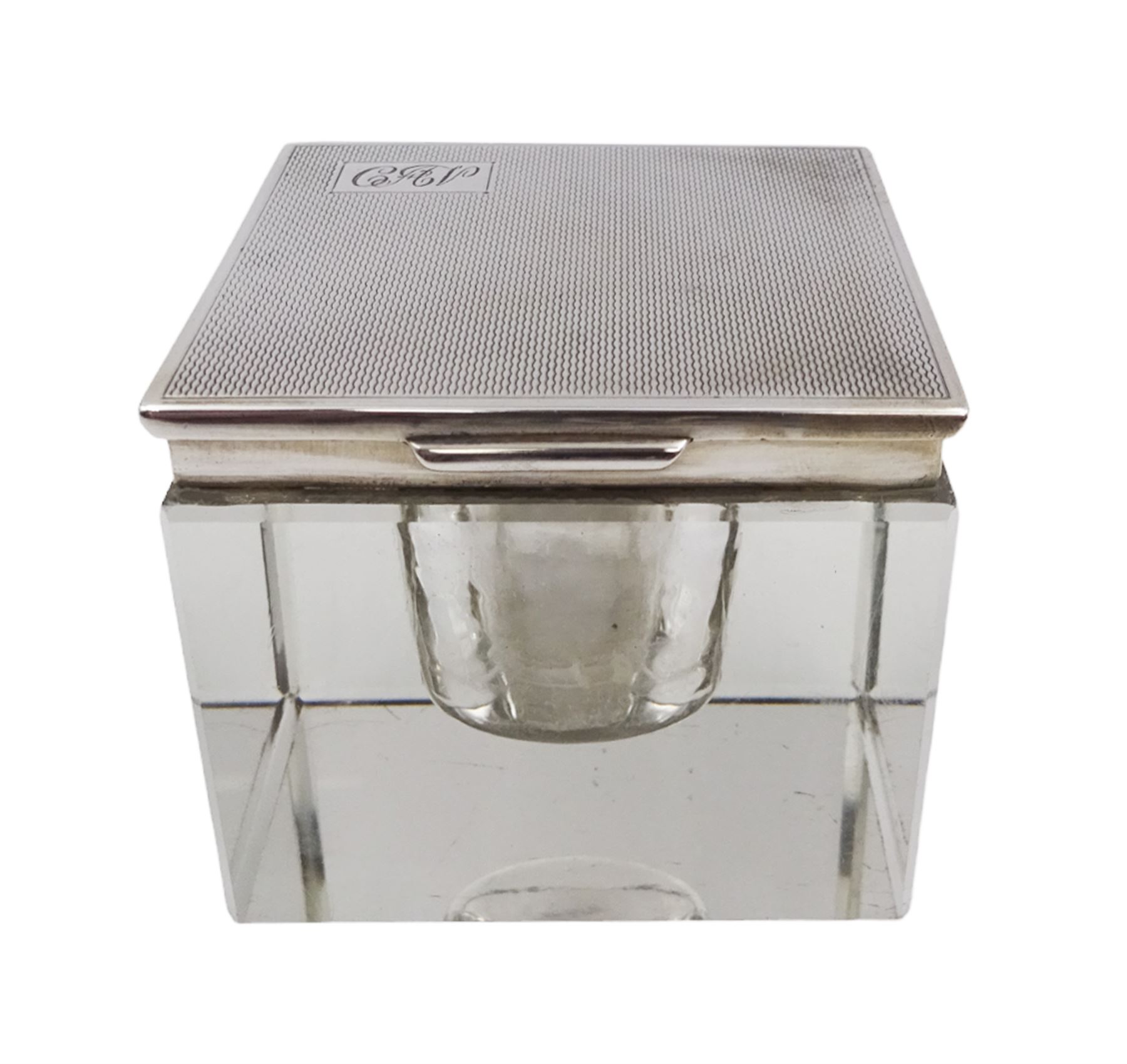 1930s silver mounted glass inkwell, of square form, the silver lid with engine turned decoration and engraved initials, hallmarked Adie Brothers Ltd, Birmingham 1937, H4.7cm