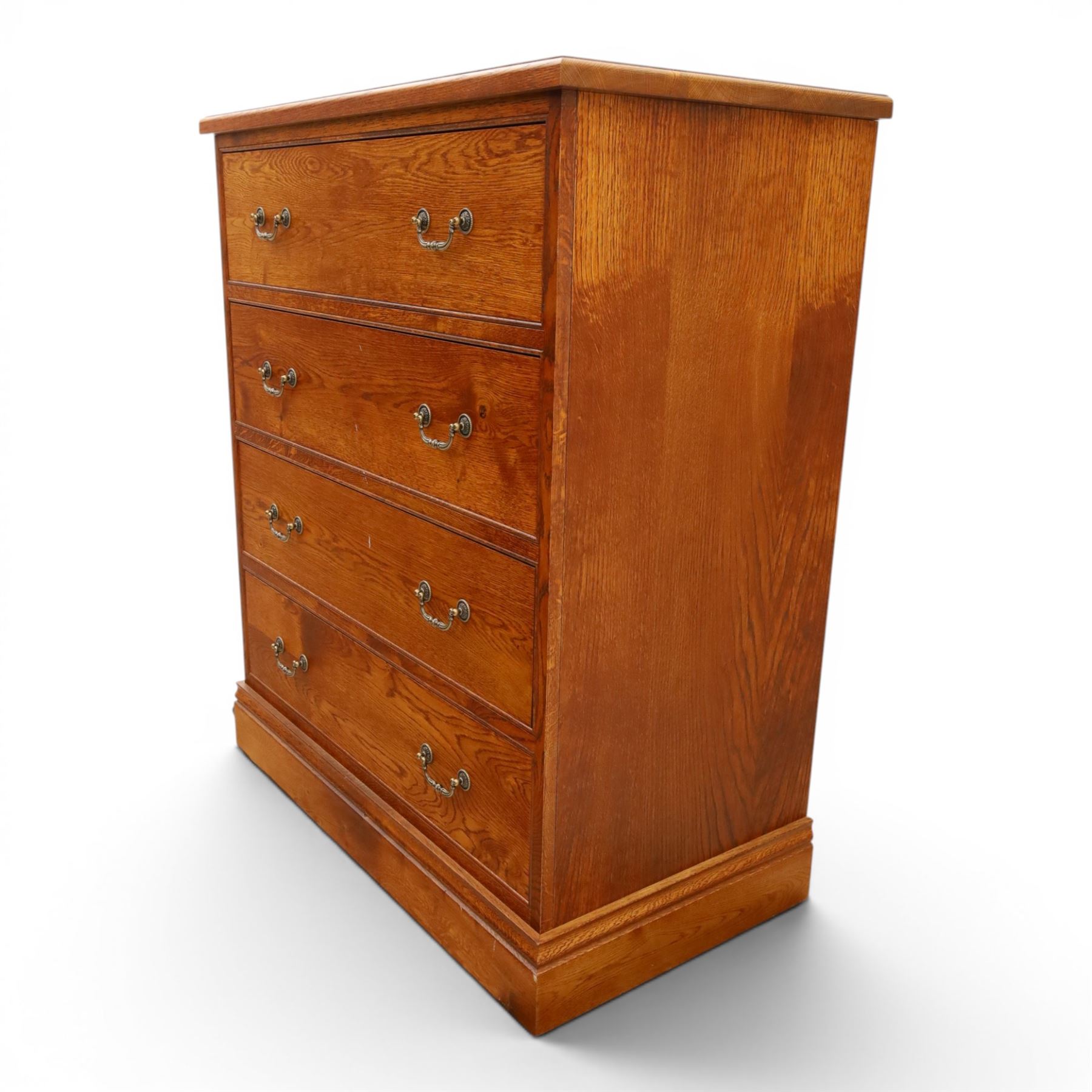 Cabinet-made oak chest, fitted with four soft-close drawers, brass swan neck handles and pierced backplates, on bracket feet