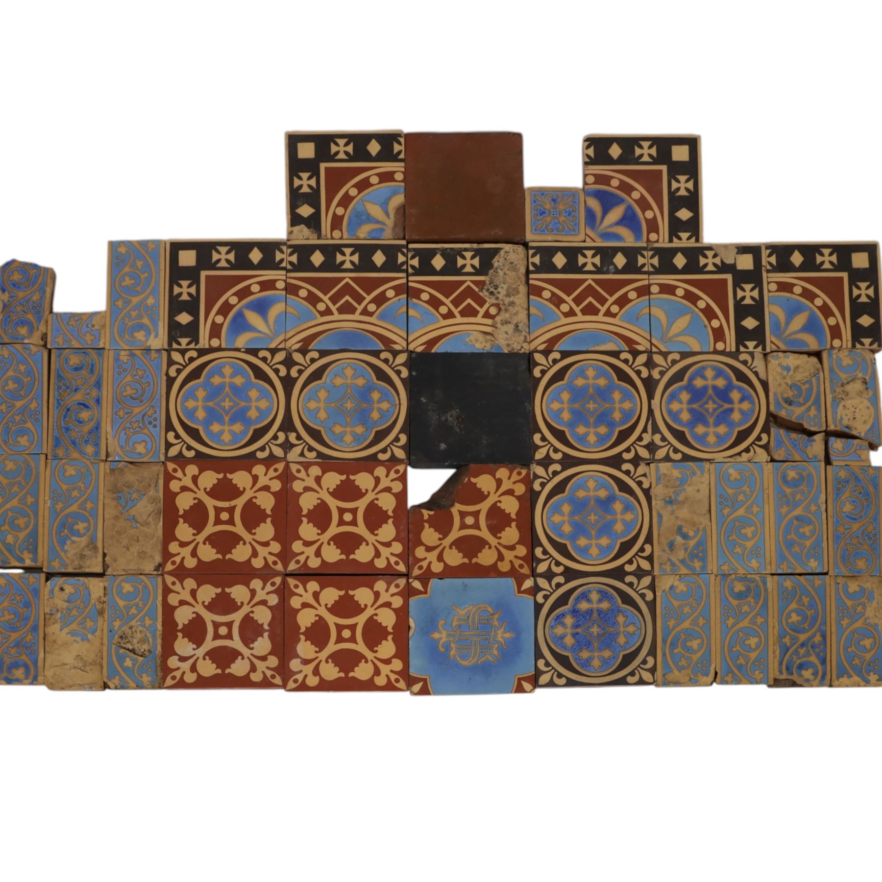 Minton & Co, Gothic Revival polychrome encaustic floor tiles, circa 1850, including six decorated with a central cardinal quatrefoil upon a blue ground, boarder tiles with scrolling vines and similar