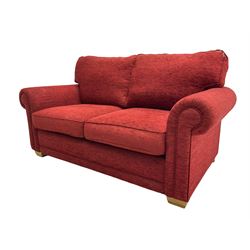 Two seat metal actions sofa bed upholstered in red cover