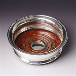 Pair of silver bottle coasters with turned wooden bases D13.5cm Birmingham 1969 Maker Barker Bros.Silver Ltd 